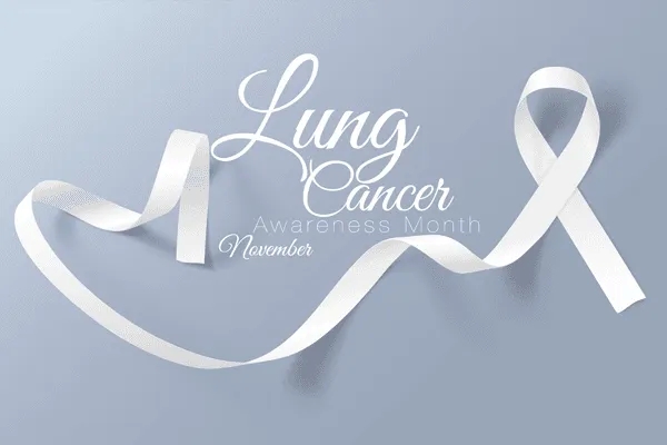 A white ribbon is arranged on a light gray background with text that reads 